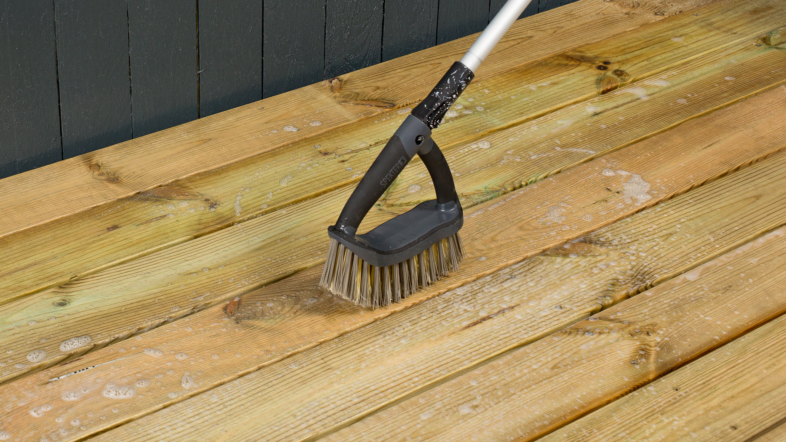 Scrubbing deck Scrubbing a wooden deck