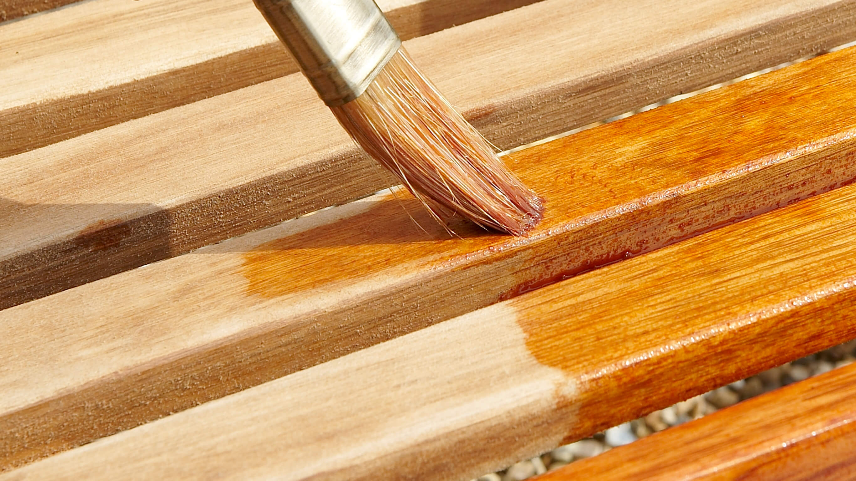 Varnishing wood Outdoor wooden furniture being varnished